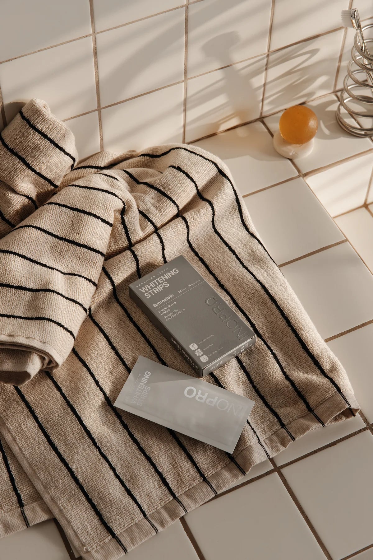 Advanced whitening strips as part of a bathroom routine